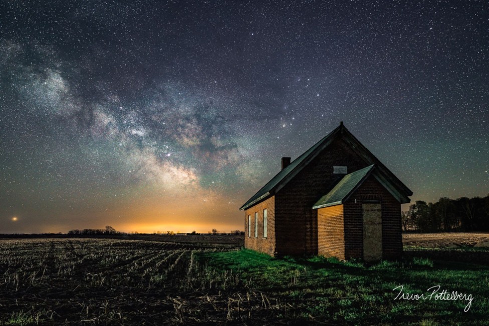 The Milky Way captured over an old schoolhouse