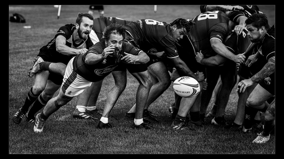 Rugby players jumping on the ball by Riverview sports photographer Jason Bowie