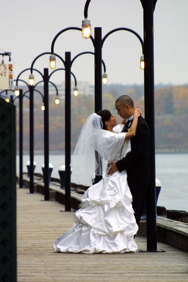 A wedding portrait under street lamps, by Bruce Berry