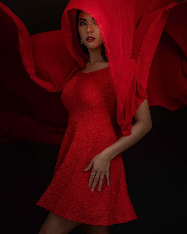 A portrait of a young woman in a red dress by Moncton photographer, Jason Bowie.