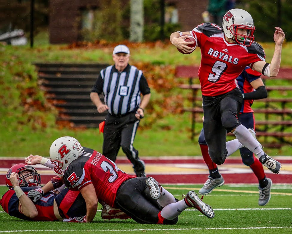 Sports action photo captured during an NBIAA_ASINB high school football playoff game between rivals Tantramar Titans and the Riverview High Royals by photographer Jason Bowie