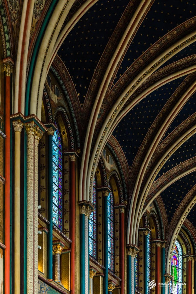 An architectural photo showing the interior of a church in Paris, by Nick De Clercq