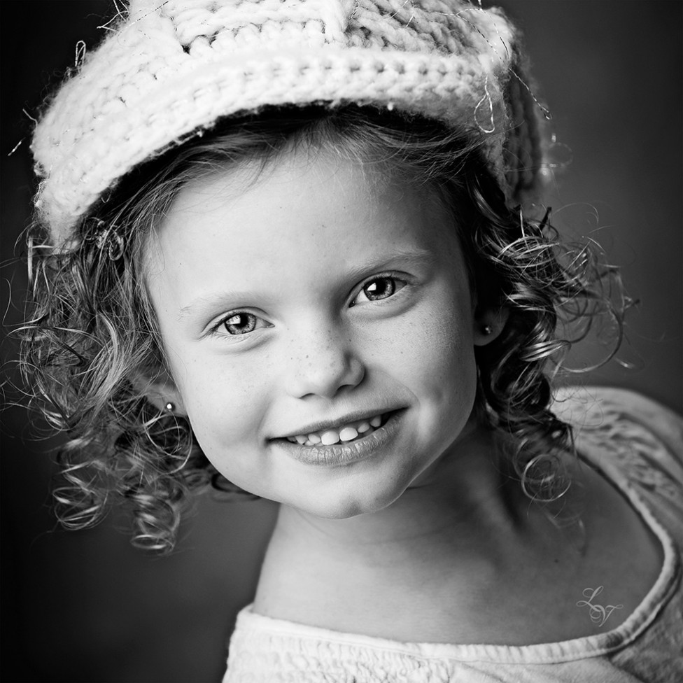 A portrait of a little girl with ringlets by Louise Vessey