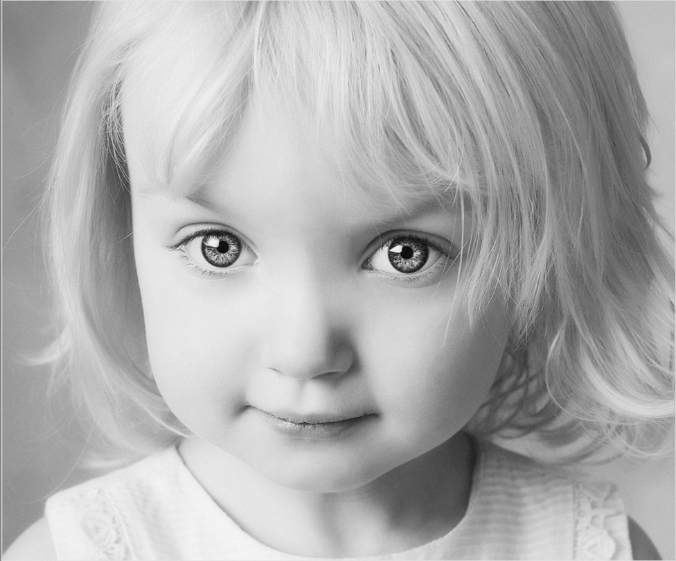 A beautiful black and white child portrait by Louise Vessey